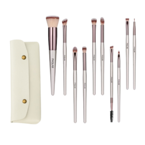 Set of makeup brushes with a cream-colored case on a white background