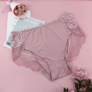 Pink lace underwear on a pink background with flowers and a magazine.